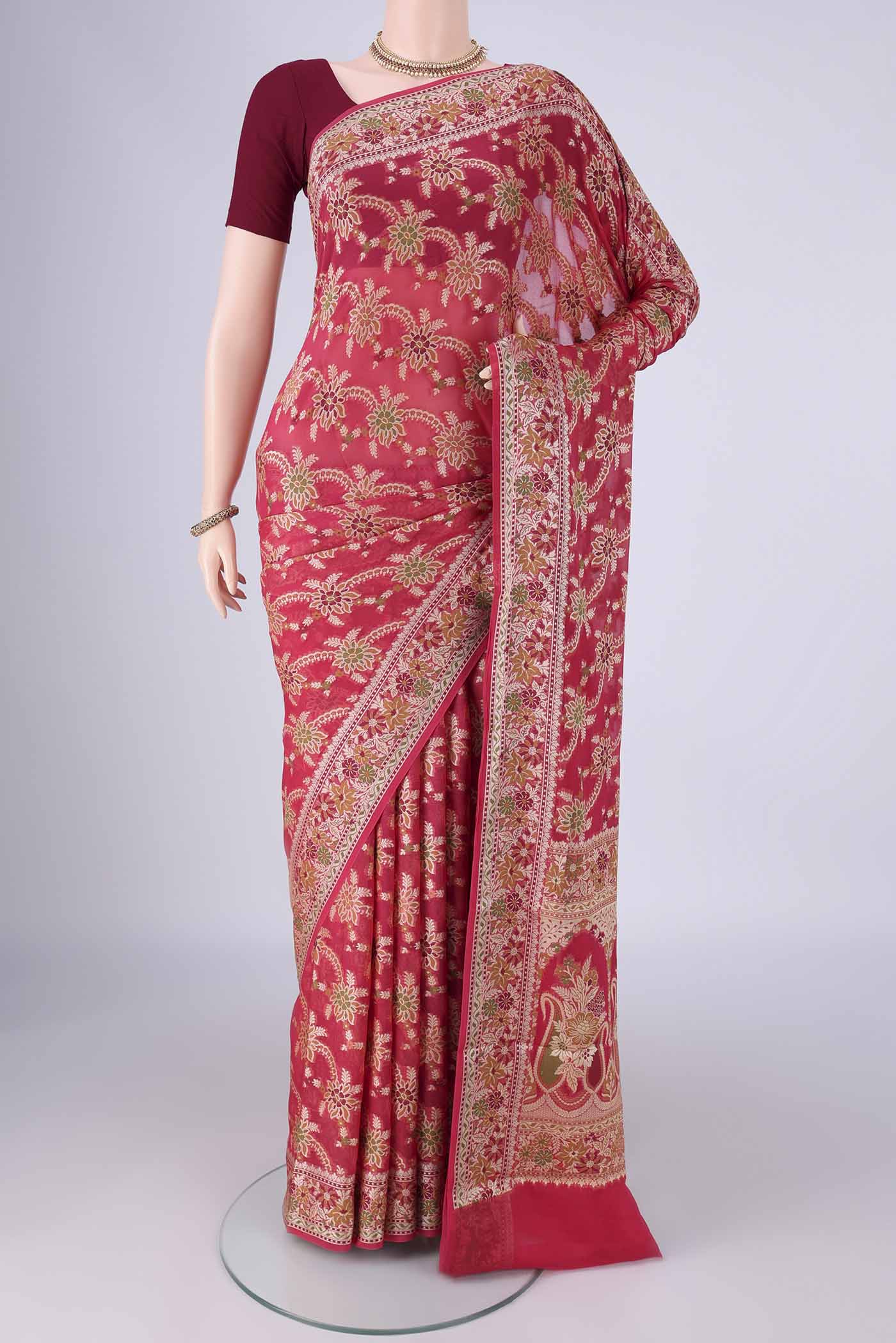 Dark Pink Blended Banarasi Georgette Saree with Zari And Thread Butta on the body and Zari And Thread Border.  displayed on a mannequin