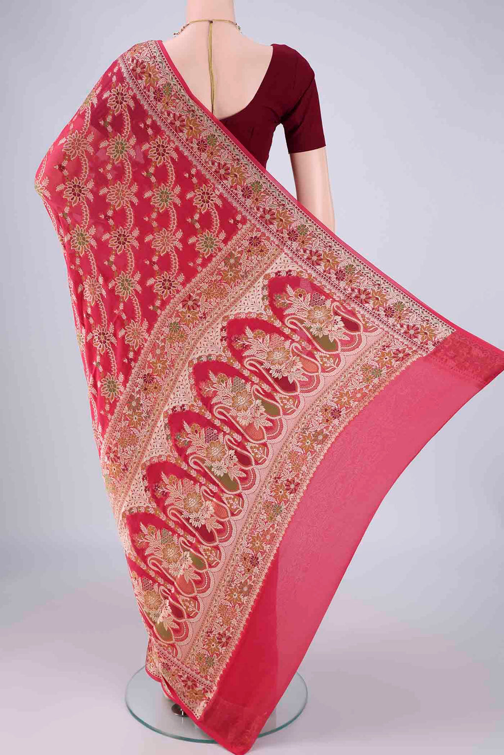 Flat view of Dark Pink Blended Banarasi Georgette Saree with Zari And Thread Butta on the body and Zari And Thread Border. 