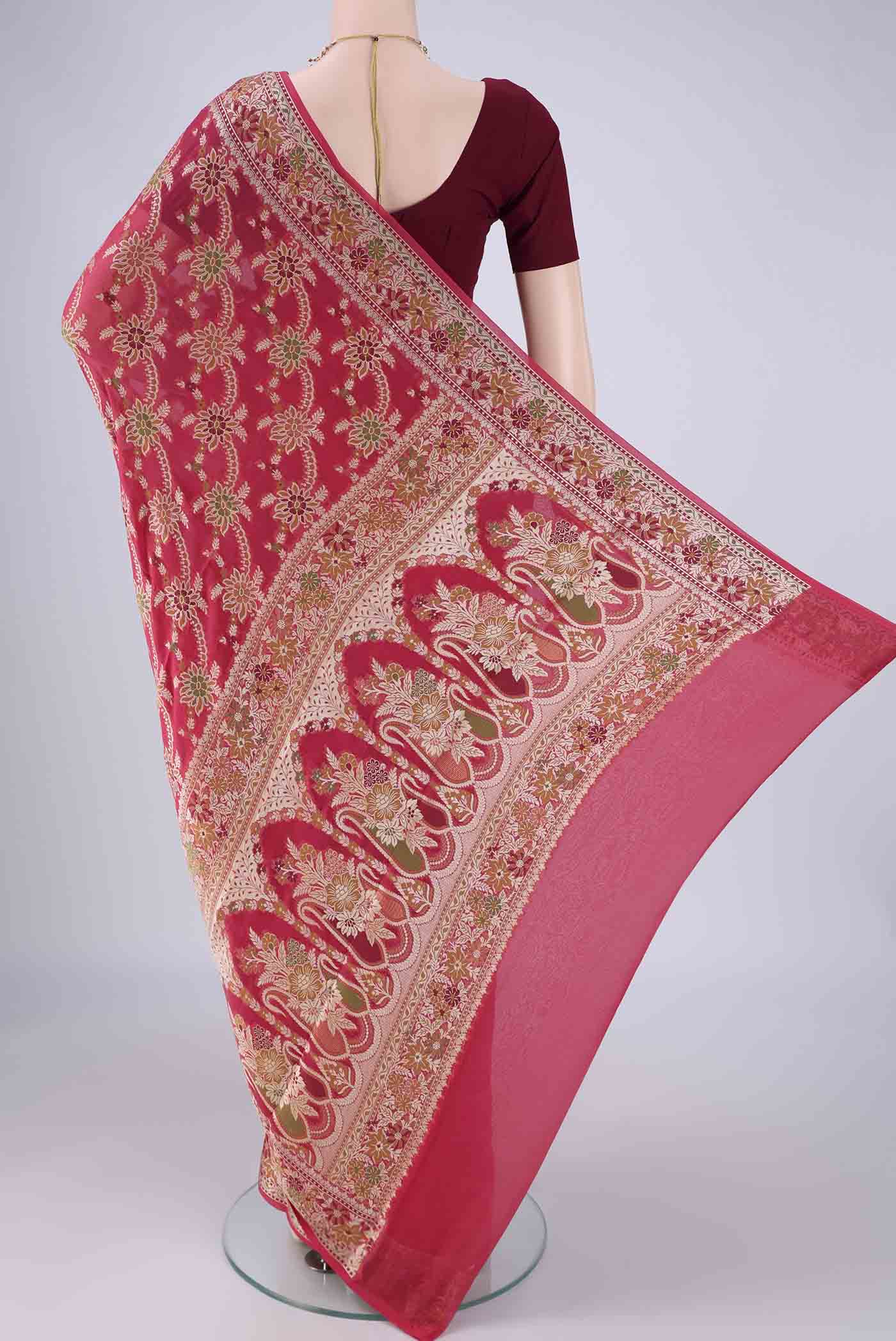 Flat view of Dark Pink Blended Banarasi Georgette Saree with Zari And Thread Butta on the body and Zari And Thread Border. 
