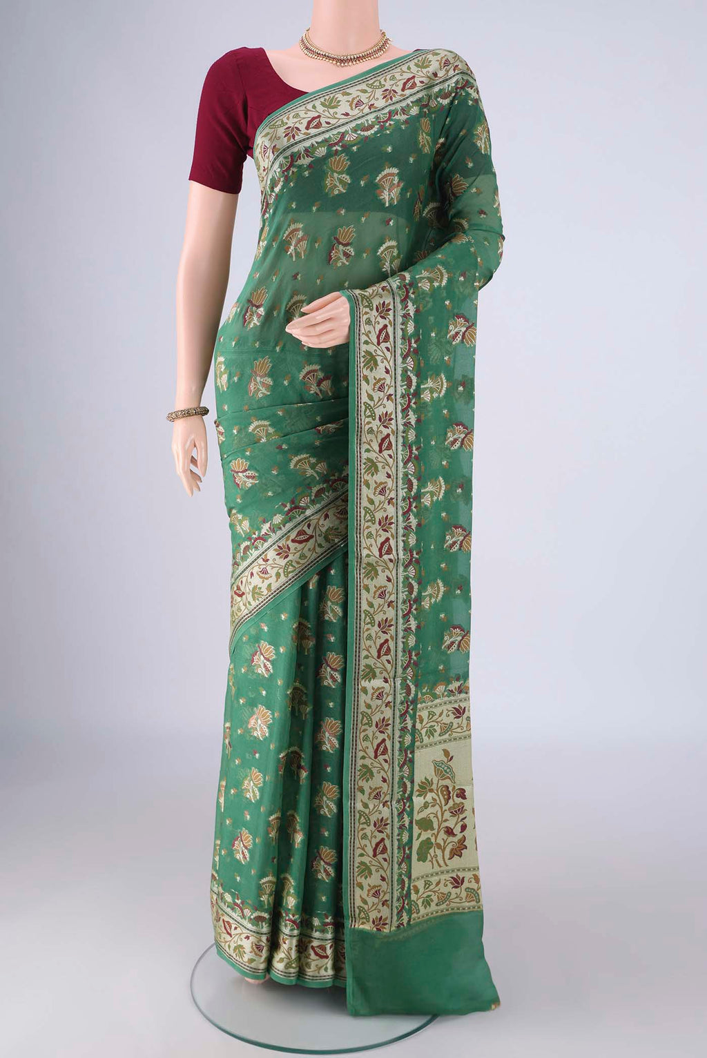 Olive Green Blended Banarasi Georgette Saree with Thread Butta on the body and Zari And Thread Border.  displayed on a mannequin