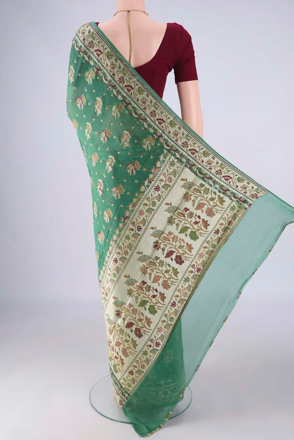 Flat view of Olive Green Blended Banarasi Georgette Saree with Thread Butta on the body and Zari And Thread Border. 