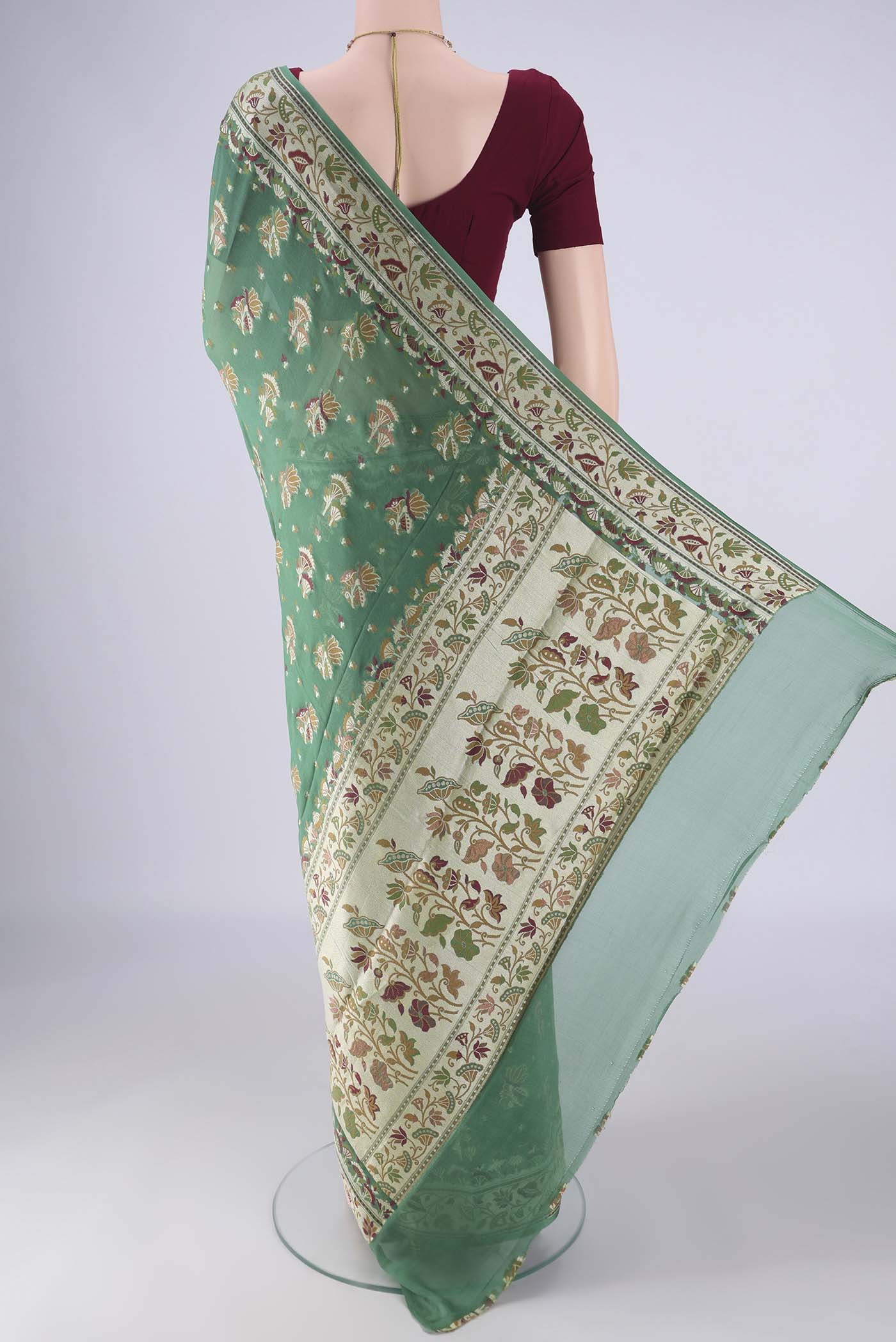 Flat view of Olive Green Blended Banarasi Georgette Saree with Thread Butta on the body and Zari And Thread Border. 