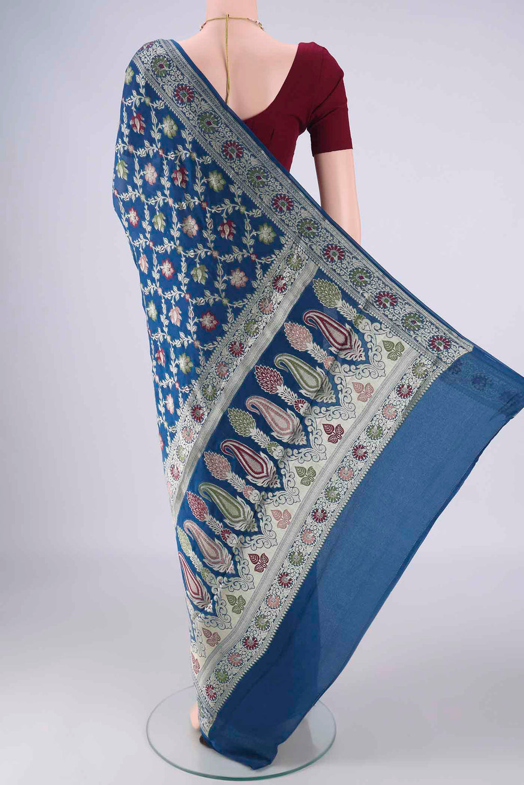 Flat view of Blue Blended Banarasi Georgette Saree with Zari And Thread Butta on the body and Zari And Thread Border. 