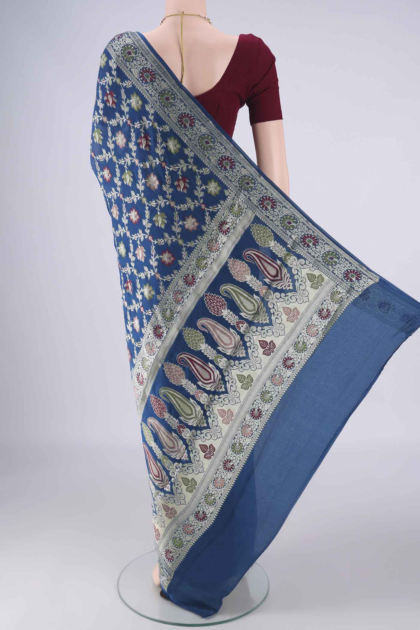 Flat view of Blue Blended Banarasi Georgette Saree with Zari And Thread Butta on the body and Zari And Thread Border. 
