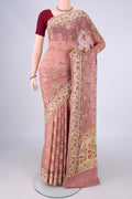 Rose Gold Blended Banarasi Georgette Saree with Zari And Thread Butta on the body and Zari And Thread Border.  displayed on a mannequin