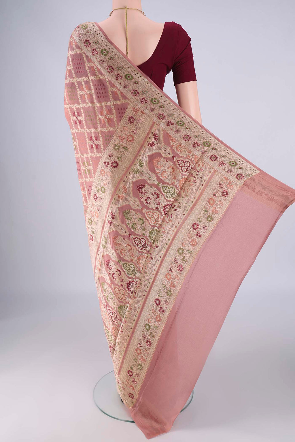 Flat view of Rose Gold Blended Banarasi Georgette Saree with Zari And Thread Butta on the body and Zari And Thread Border. 