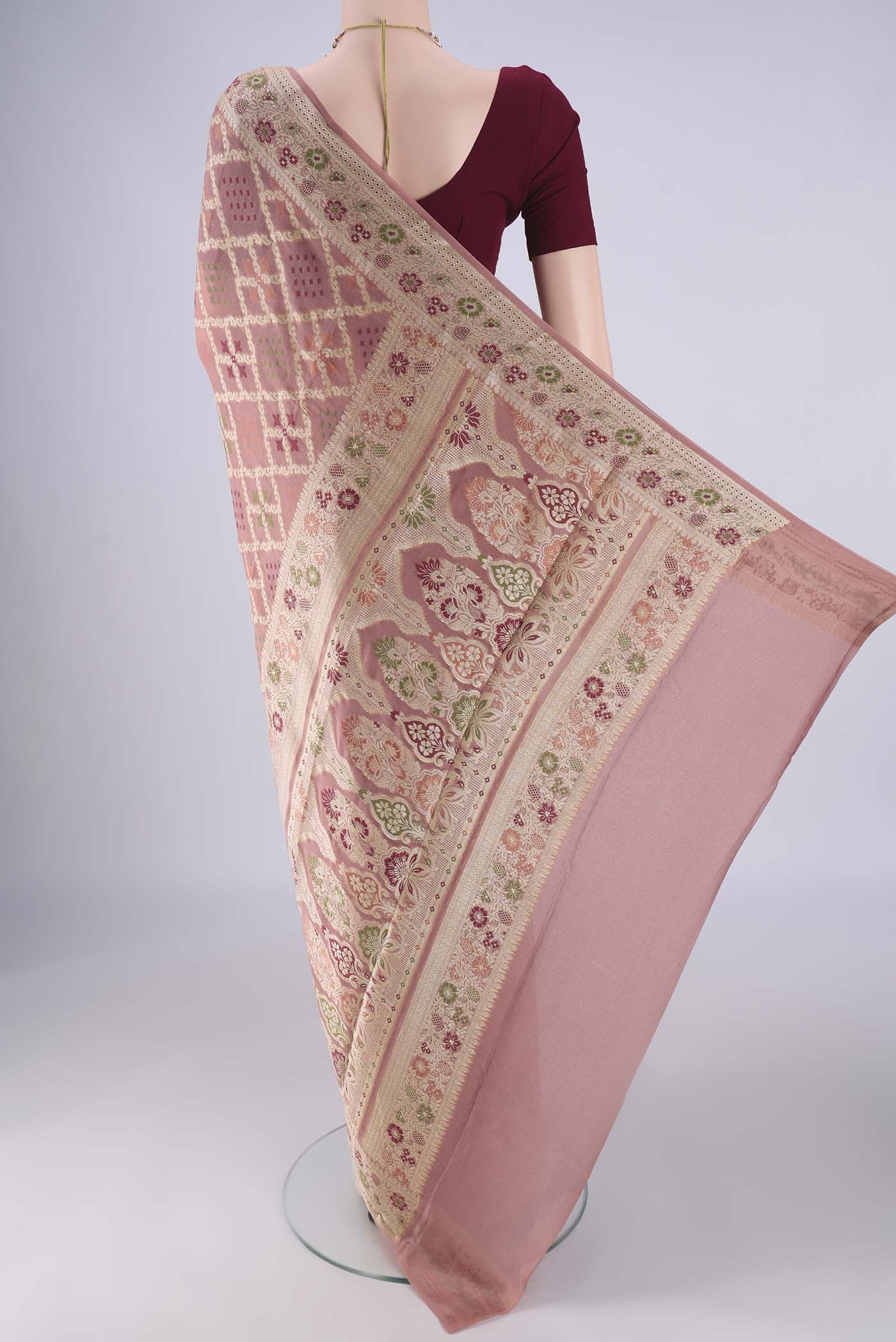 Flat view of Rose Gold Blended Banarasi Georgette Saree with Zari And Thread Butta on the body and Zari And Thread Border. 
