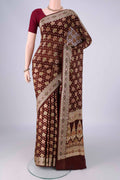 Brown Blended Banarasi Georgette Saree with Zari And Thread Butta on the body and Zari And Thread Border.  displayed on a mannequin