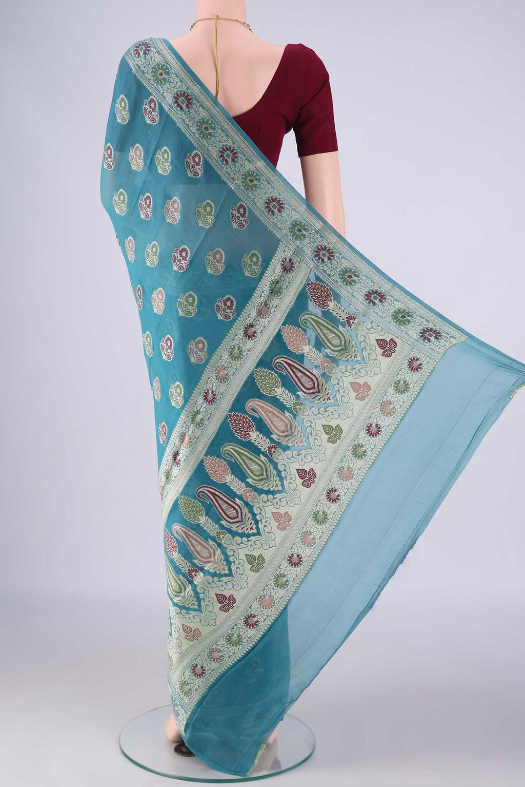 Flat view of Maya Blue Blended Banarasi Georgette Saree with Thread Butta on the body and Zari And Thread Border. 