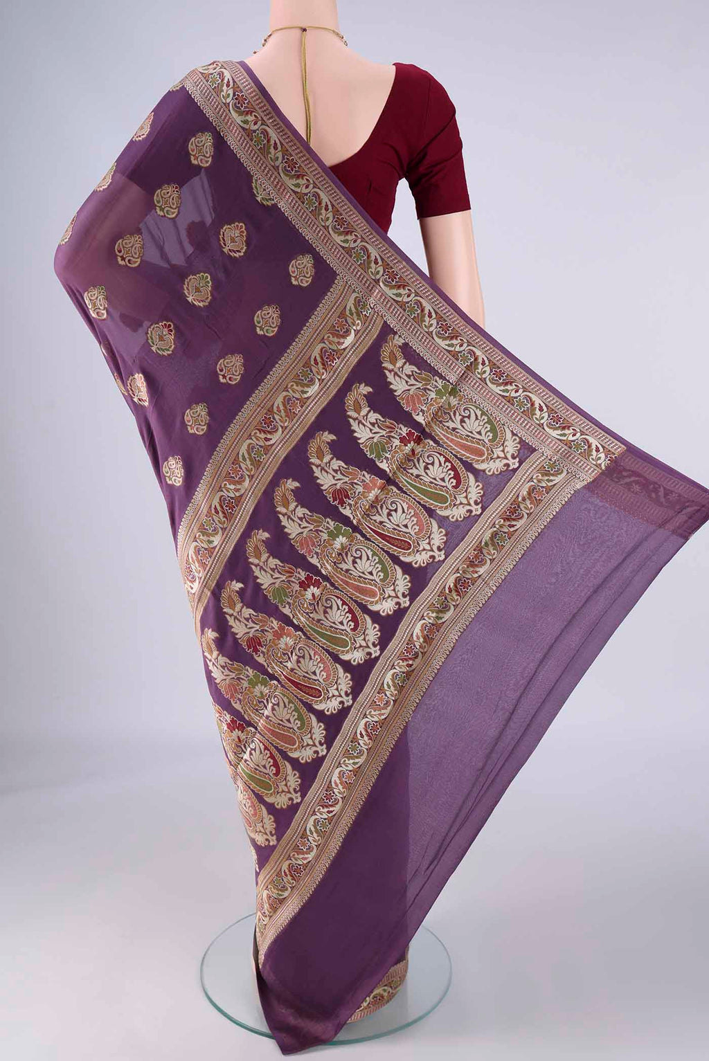 Flat view of Purple Blended Banarasi Georgette Saree with Zari And Thread Butta on the body and Zari And Thread Border. 