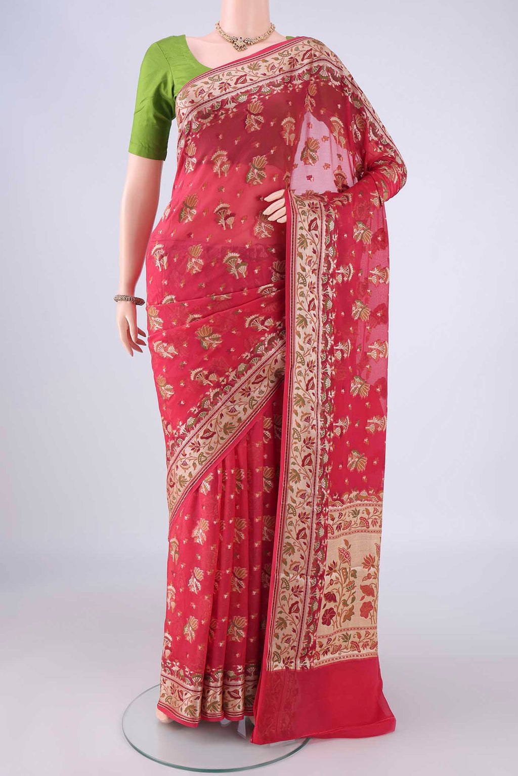 Coral Blended Banarasi Georgette Saree with Zari And Thread Butta on the body and Zari And Thread Border.  displayed on a mannequin