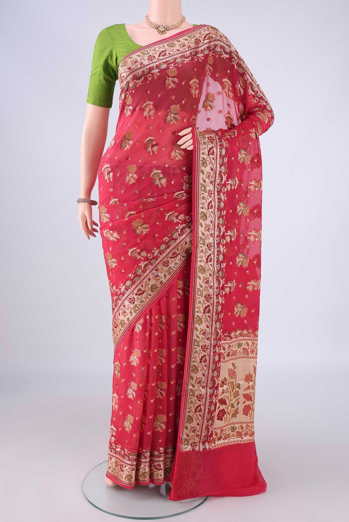 Coral Blended Banarasi Georgette Saree with Zari And Thread Butta on the body and Zari And Thread Border.  displayed on a mannequin