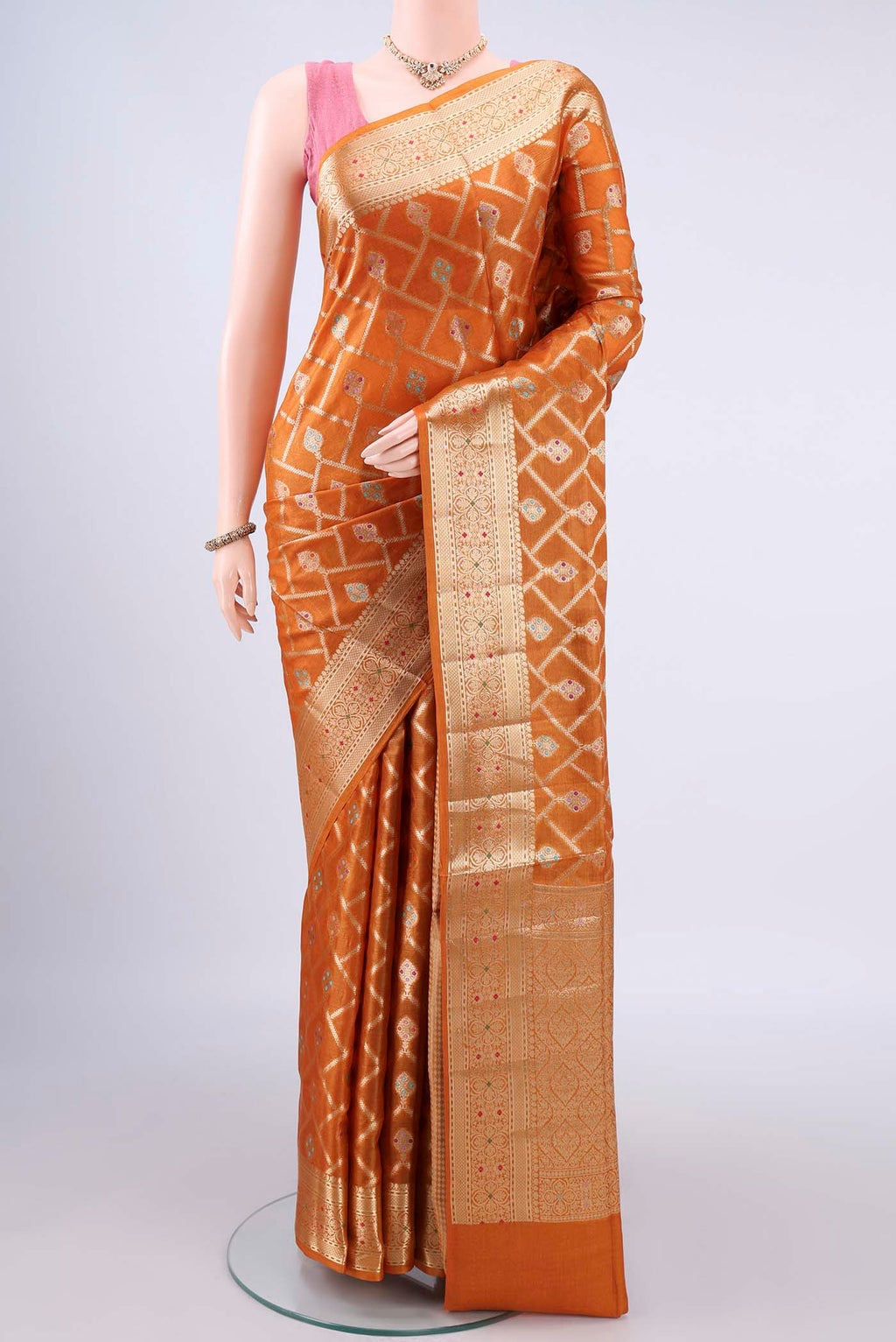 Mustard Banarasi Tussar Saree with Zari And Thread Butta on the body and Zari Border.  displayed on a mannequin