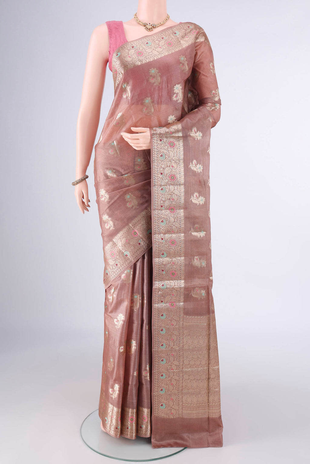 Beige Banarasi Tussar Saree with Zari And Thread Butta on the body and Zari And Thread Border.  displayed on a mannequin