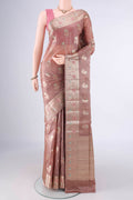 Beige Banarasi Tussar Saree with Zari And Thread Butta on the body and Zari And Thread Border.  displayed on a mannequin