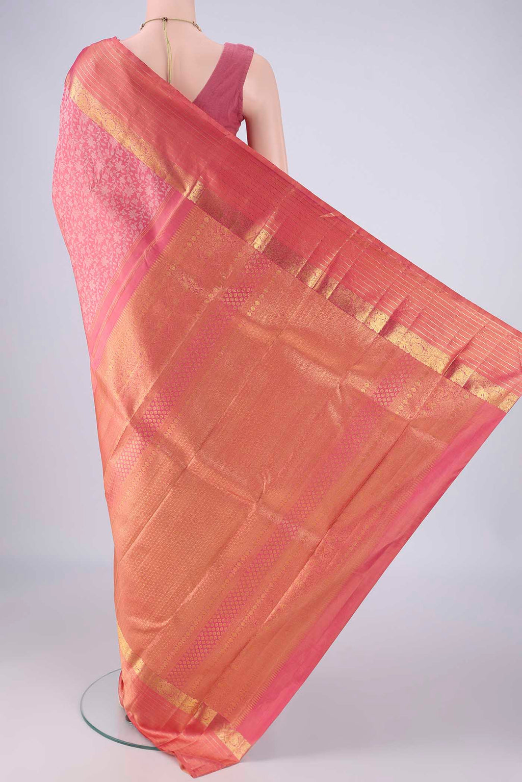 Flat view of Rose pink Kanjivaram Silk Saree with Jacquard design on the body and Zari Border. 