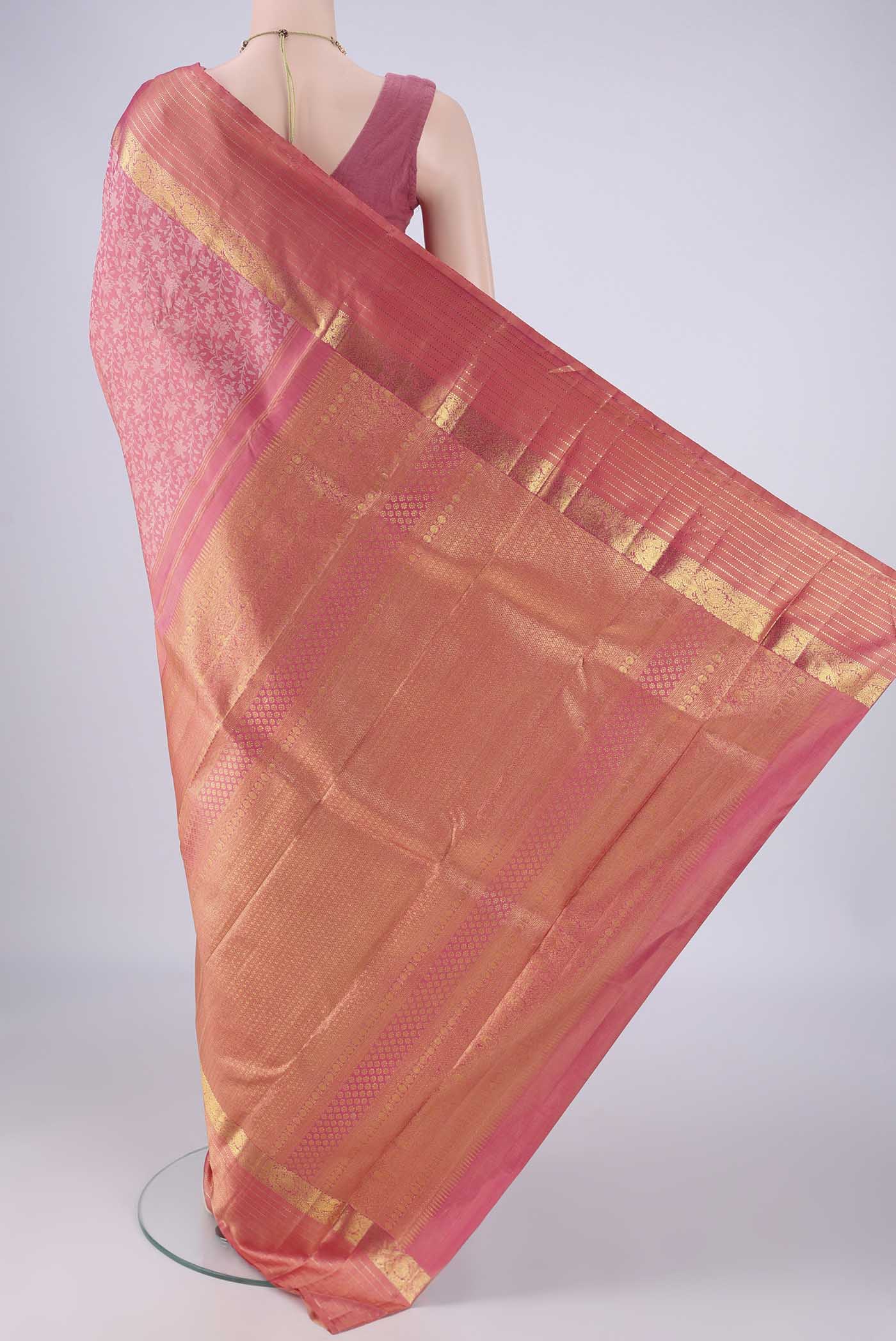 Flat view of Rose pink Kanjivaram Silk Saree with Jacquard design on the body and Zari Border. 