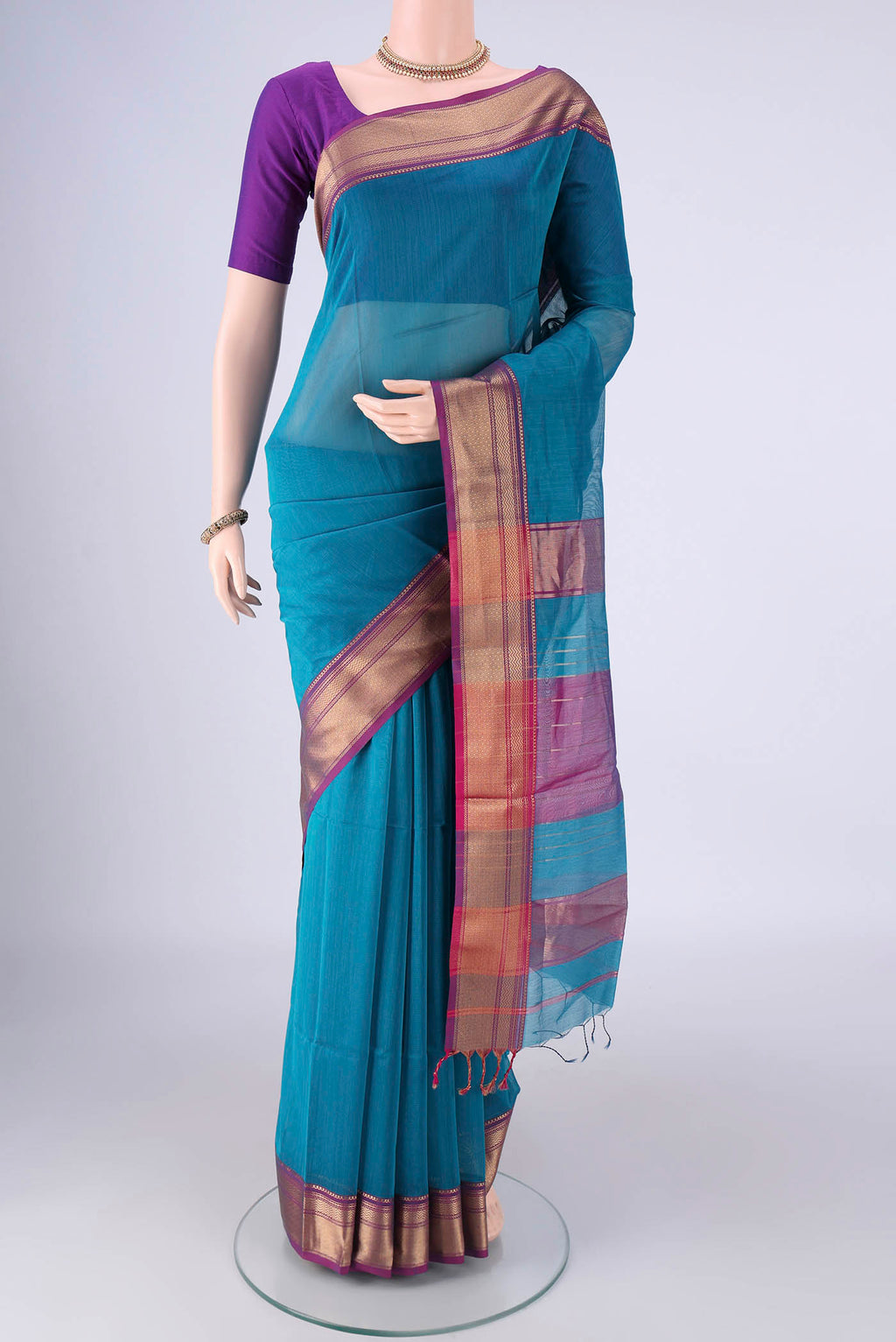 Blue Maheshwari Silk Cotton Saree with Plain Body and Zari Border.  displayed on a mannequin