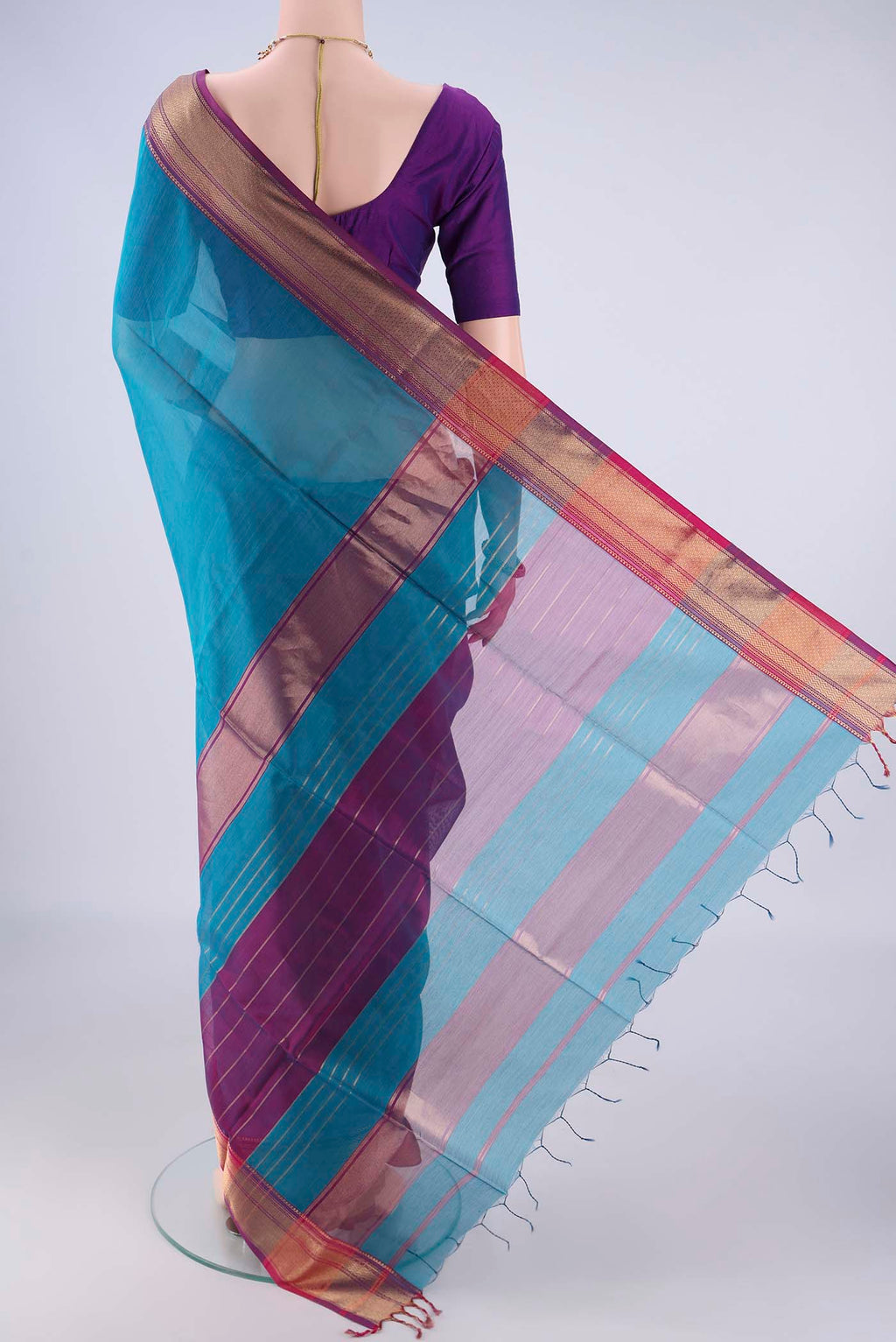 Flat view of Blue Maheshwari Silk Cotton Saree with Plain Body and Zari Border. 