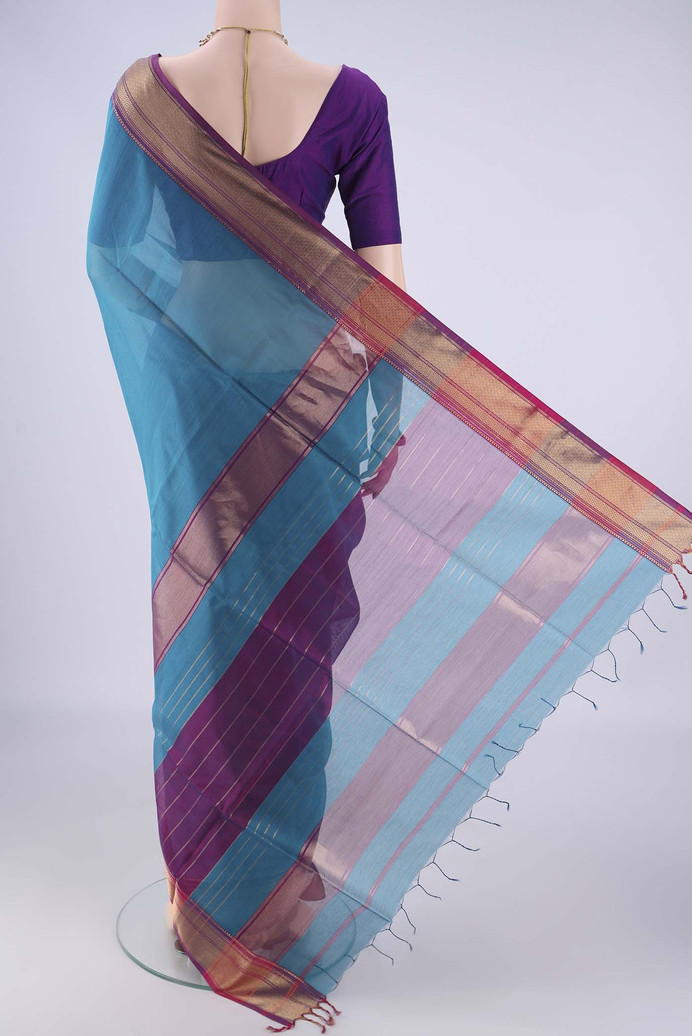 Flat view of Blue Maheshwari Silk Cotton Saree with Plain Body and Zari Border. 