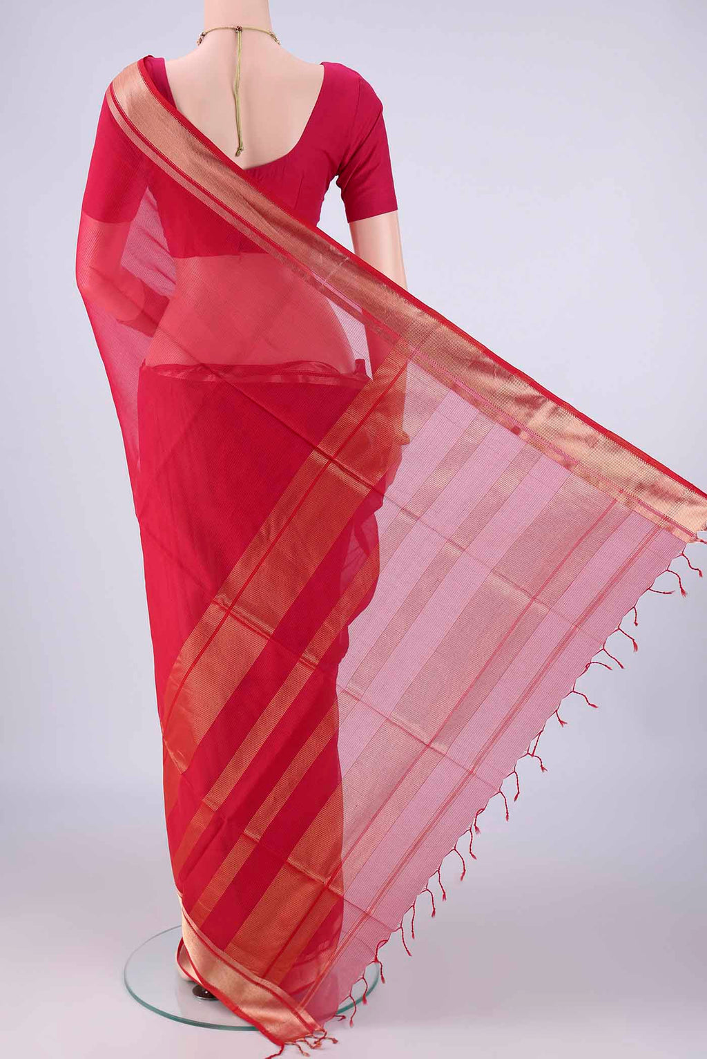 Flat view of Dark Pink Maheshwari Silk Cotton Saree with Stripes on the body and Zari Border. 