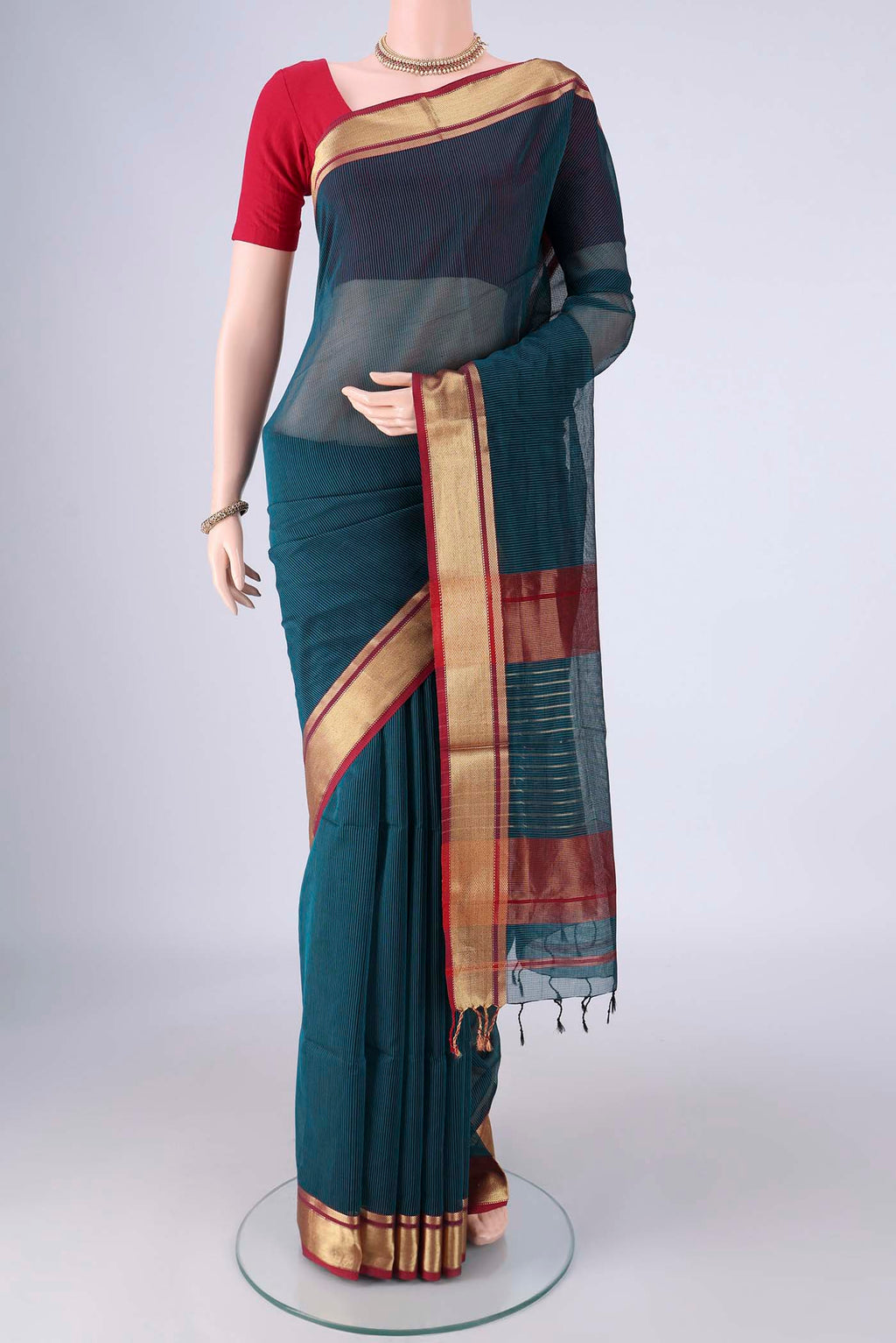 Dark Blue Maheshwari Silk Cotton Saree with Stripes on the body and Zari Border.  displayed on a mannequin
