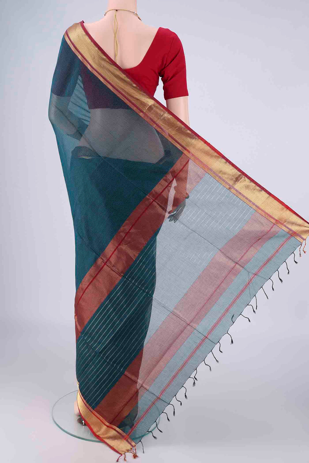 Flat view of Dark Blue Maheshwari Silk Cotton Saree with Stripes on the body and Zari Border. 