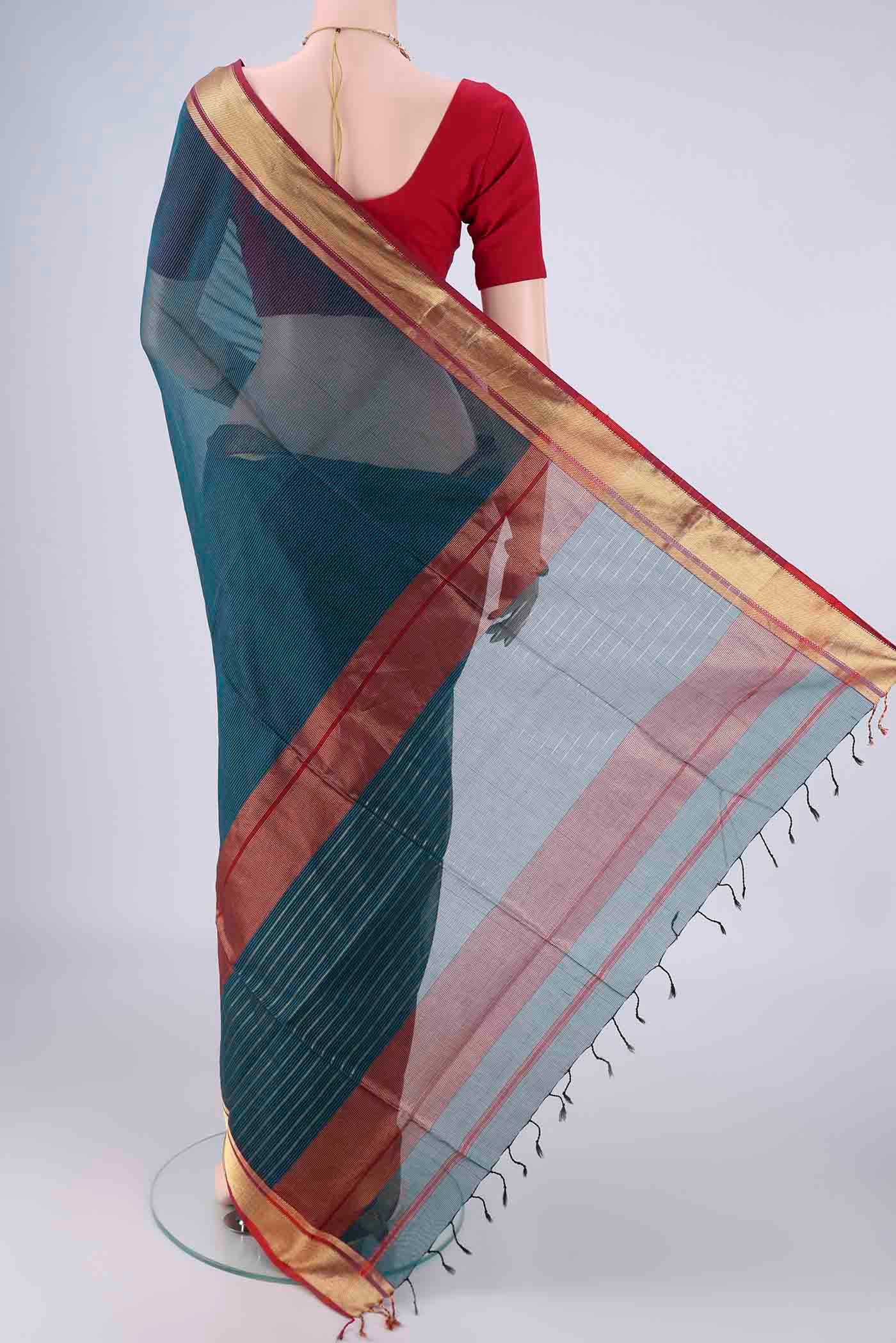 Flat view of Dark Blue Maheshwari Silk Cotton Saree with Stripes on the body and Zari Border. 