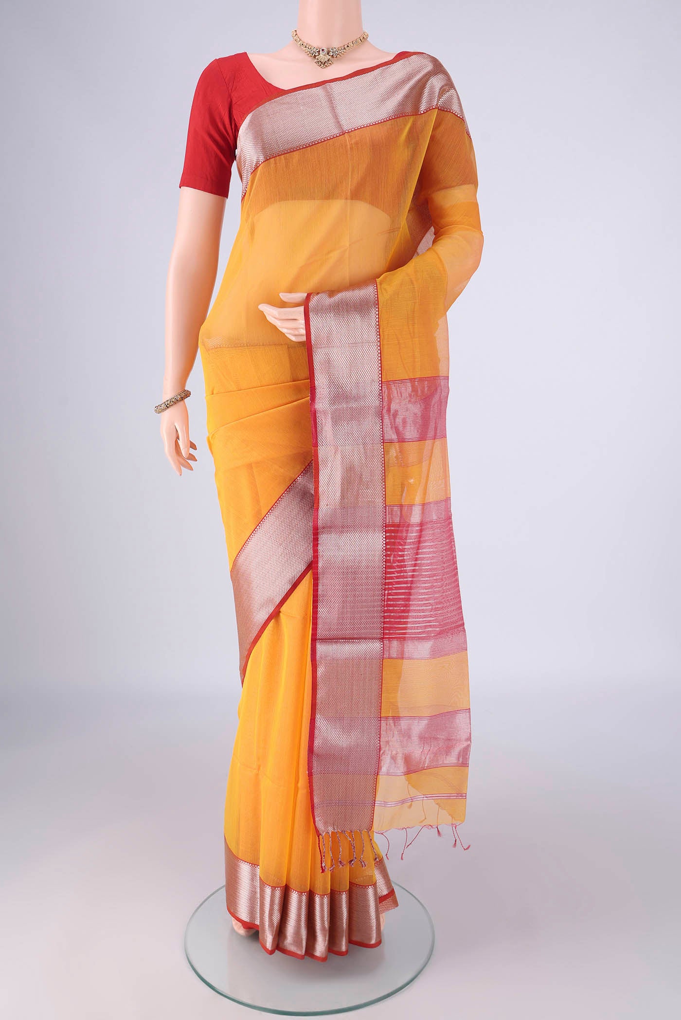 Yellow Maheshwari Silk Cotton Saree with Plain Body and Zari Border.  displayed on a mannequin