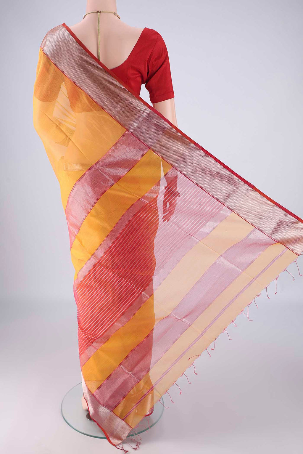 Flat view of Yellow Maheshwari Silk Cotton Saree with Plain Body and Zari Border. 