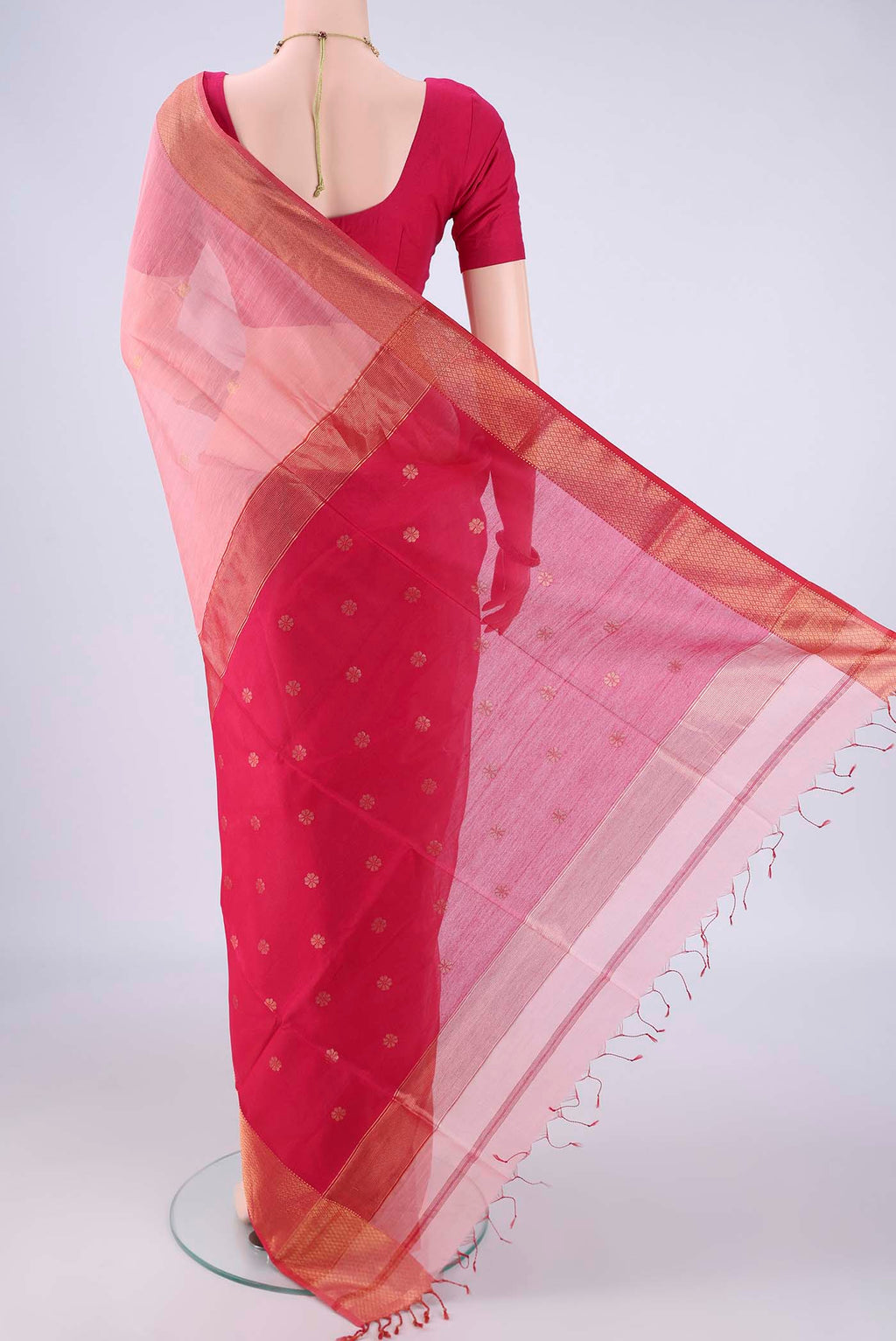 Flat view of Rose pink Maheshwari Silk Cotton Saree with Zari Butta on the body and Zari Border. 