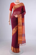 Maroon Maheshwari Cotton Saree with Stripes on the body and Zari Border.  displayed on a mannequin