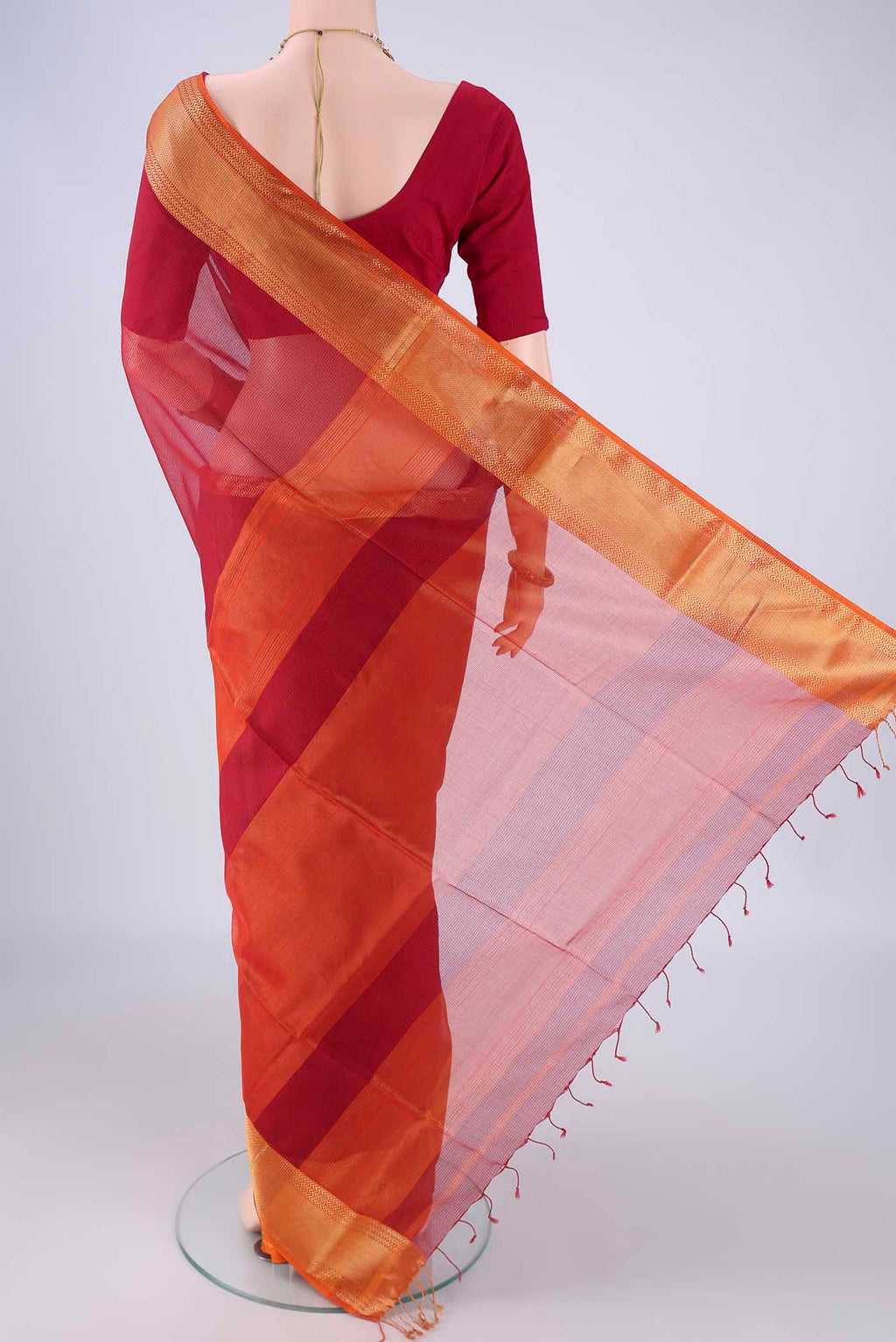 Flat view of Red Maheshwari Silk Cotton Saree with Checked design on the body and Zari Border. 