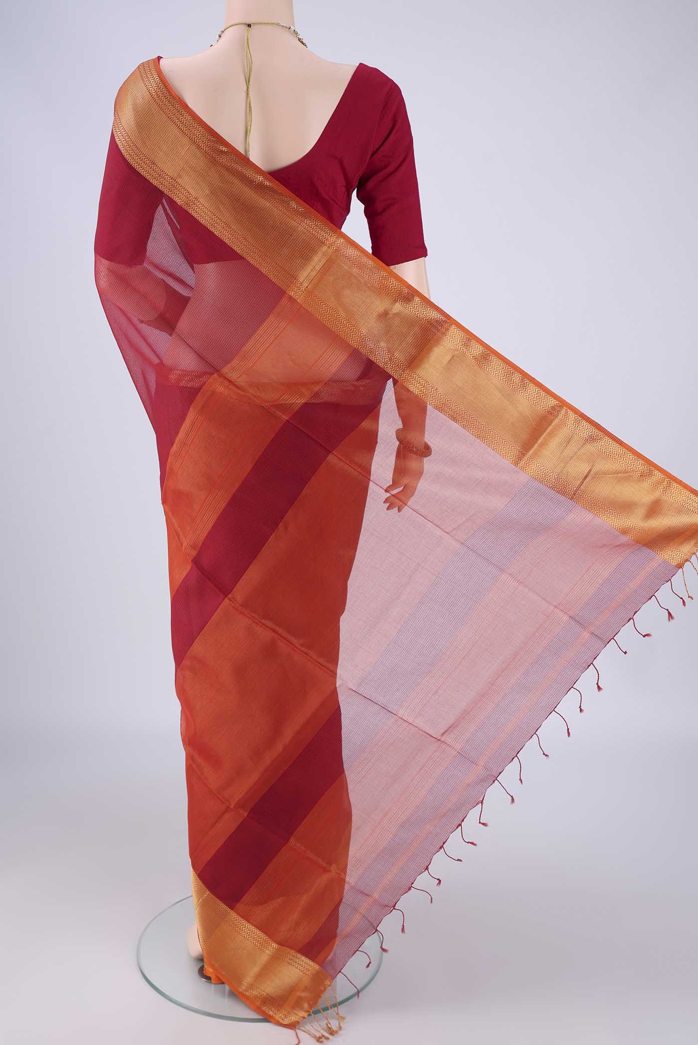 Flat view of Red Maheshwari Silk Cotton Saree with Checked design on the body and Zari Border. 