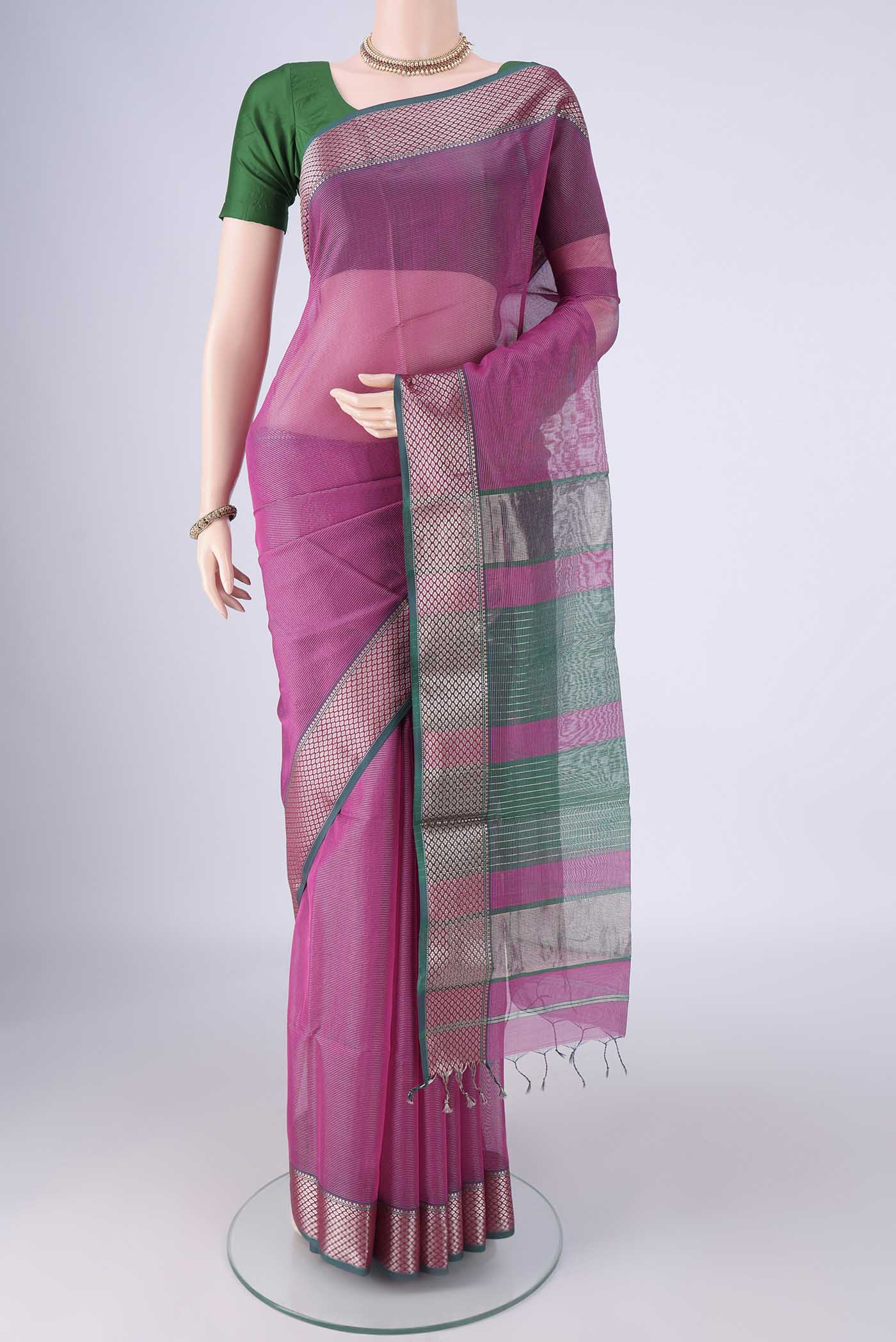 Magenta Maheshwari Silk Cotton Saree with Stripes on the body and Zari Border.  displayed on a mannequin