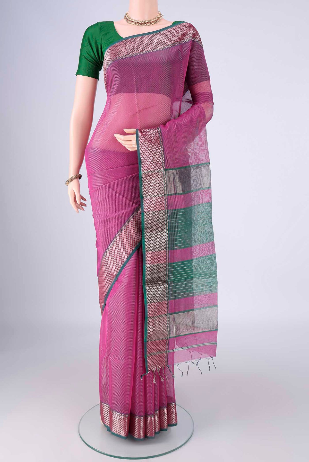 Magenta Maheshwari Silk Cotton Saree with Stripes on the body and Zari Border.  displayed on a mannequin