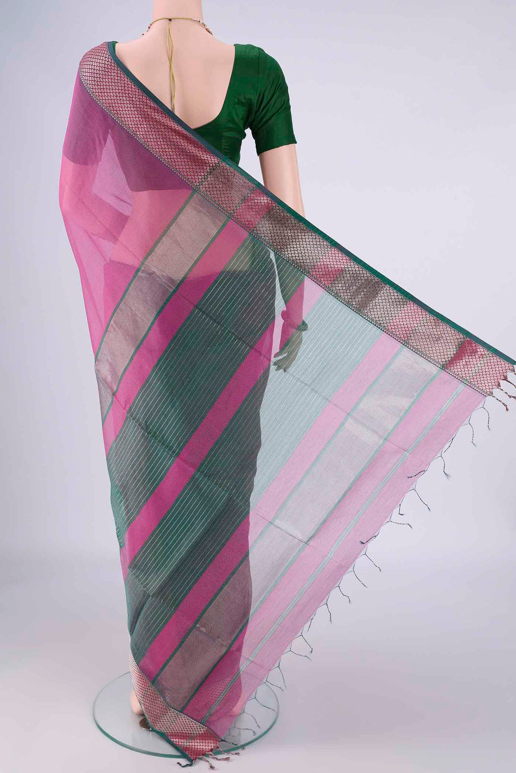 Flat view of Magenta Maheshwari Silk Cotton Saree with Stripes on the body and Zari Border. 
