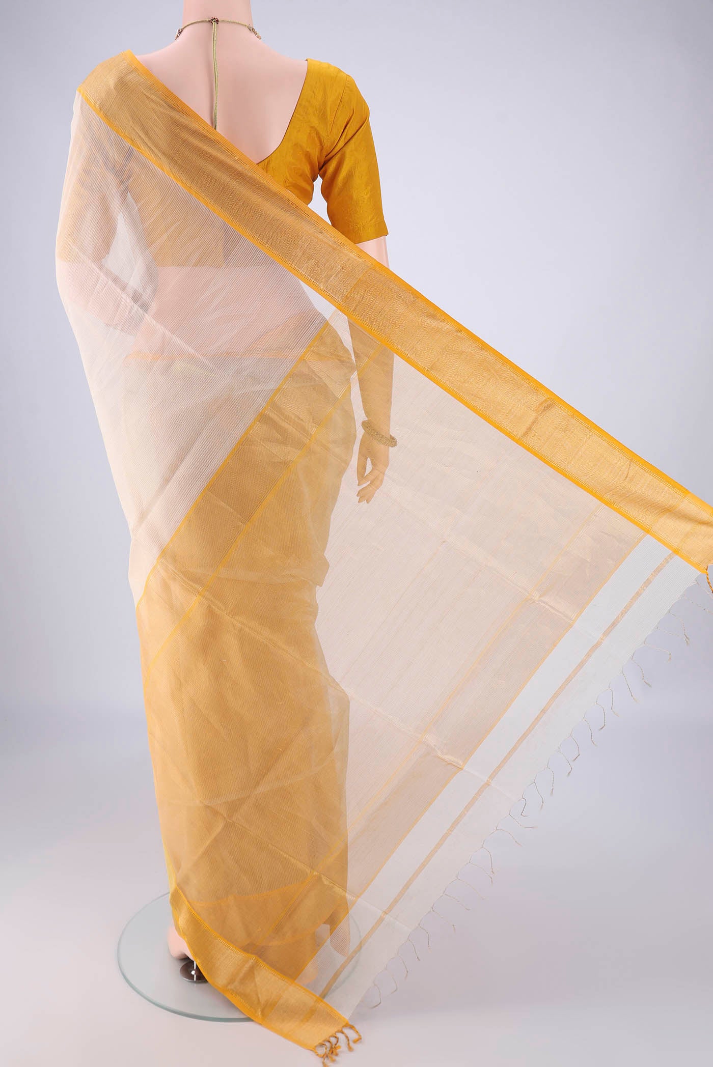 Flat view of Off White Maheshwari Silk Cotton Saree with Stripes on the body and Zari Border. 