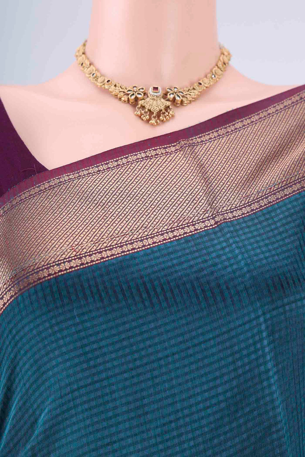Border image of Teal Maheshwari Silk Cotton Saree with Checked design on the body and Zari Border. 