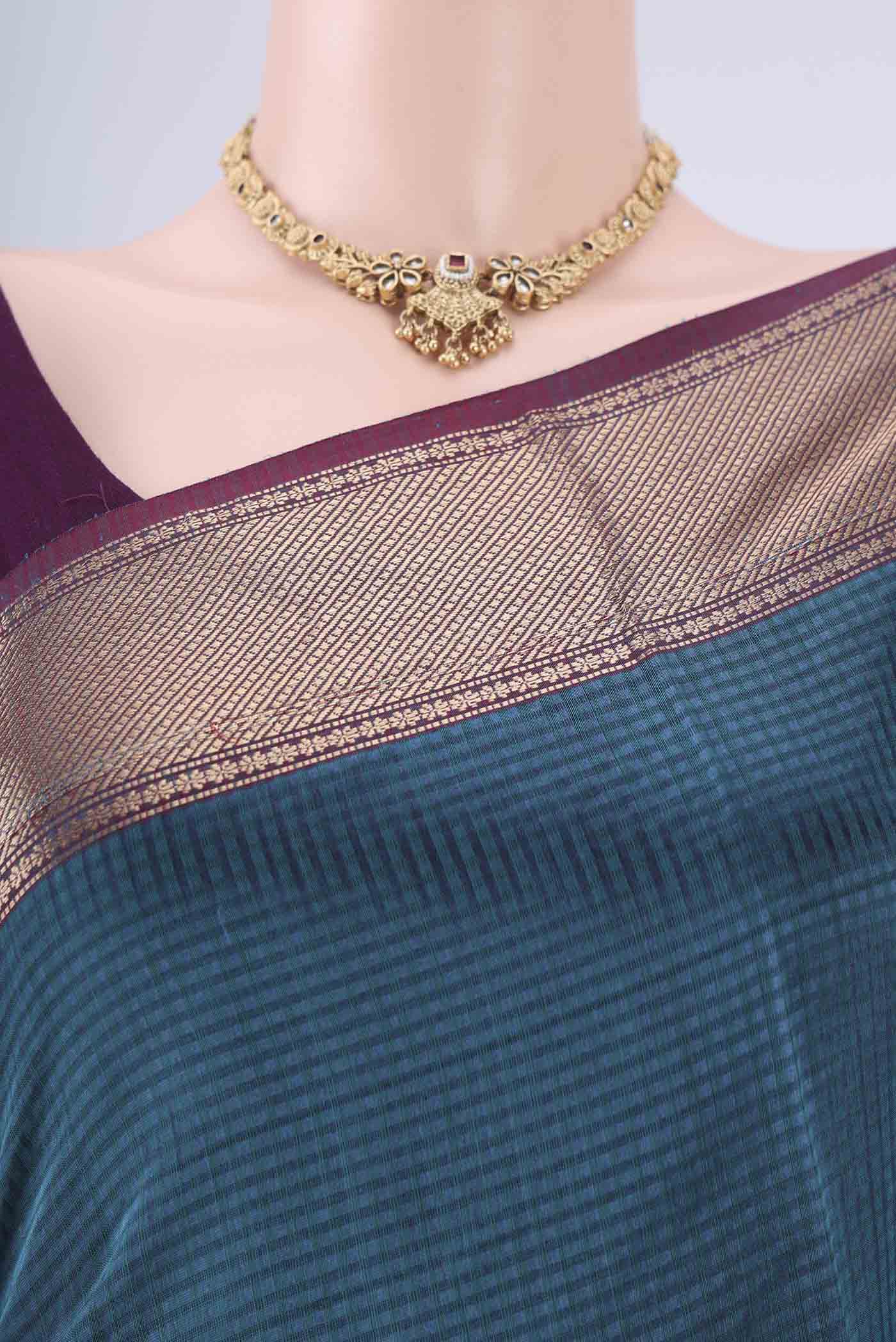 Border image of Teal Maheshwari Silk Cotton Saree with Checked design on the body and Zari Border. 