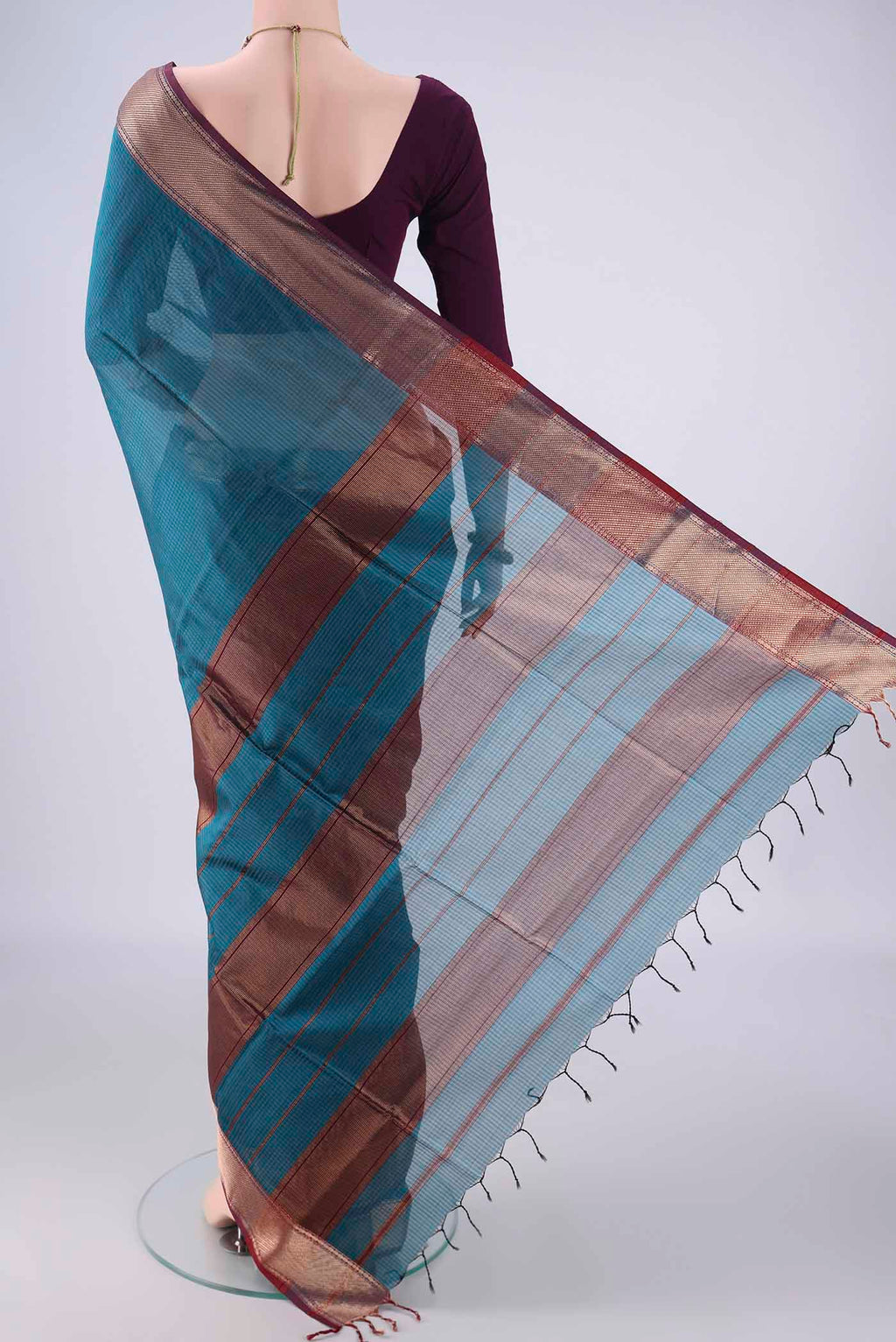 Flat view of Teal Maheshwari Silk Cotton Saree with Checked design on the body and Zari Border. 