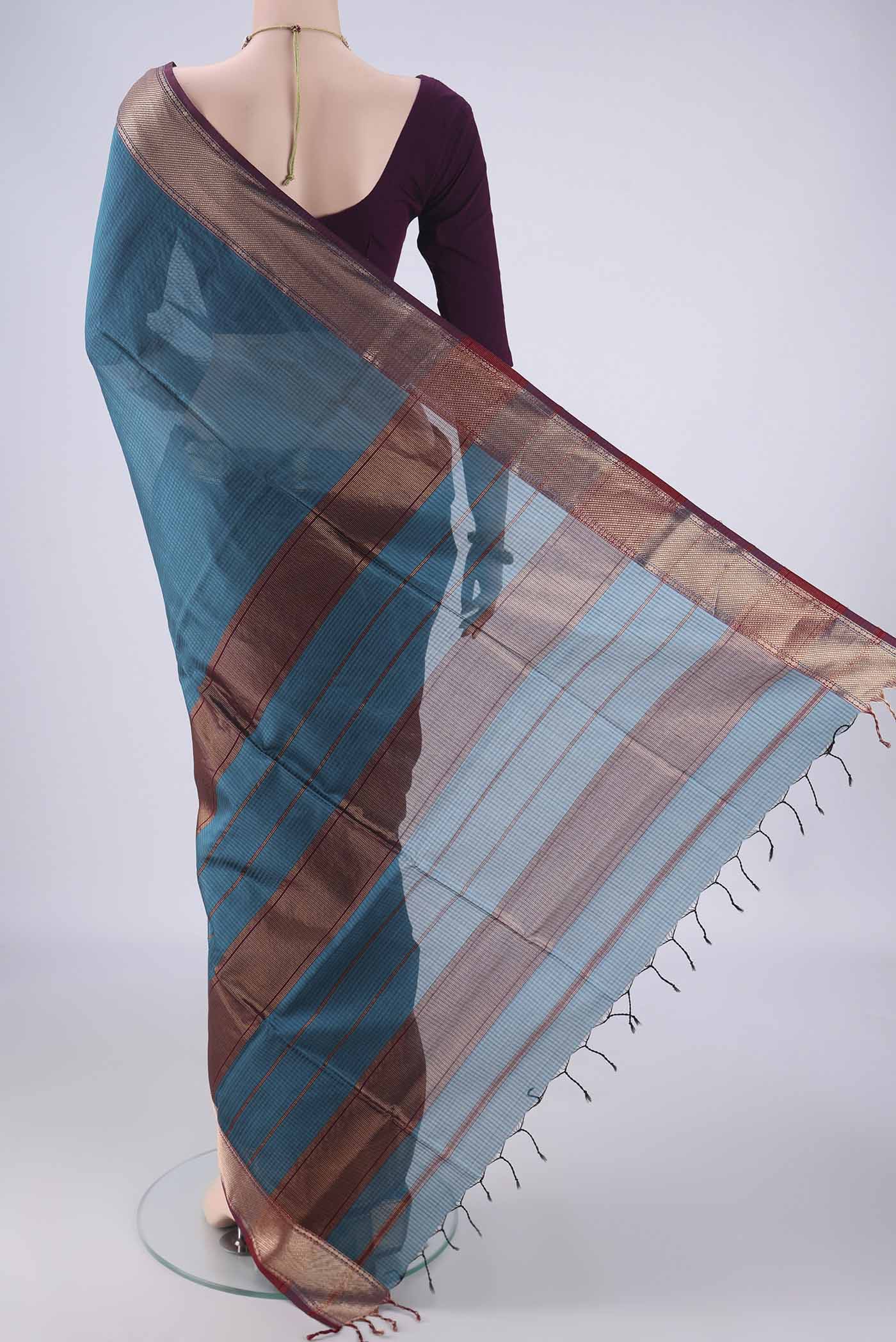 Flat view of Teal Maheshwari Silk Cotton Saree with Checked design on the body and Zari Border. 
