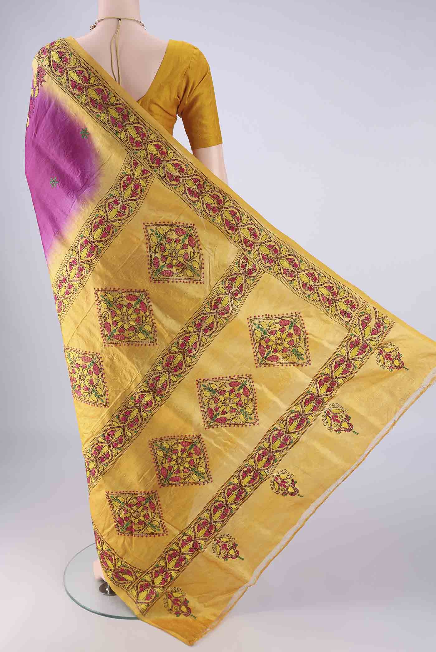 Flat view of Magenta Tussar Silk Saree with Kantha Work on the body and Thread Border. 