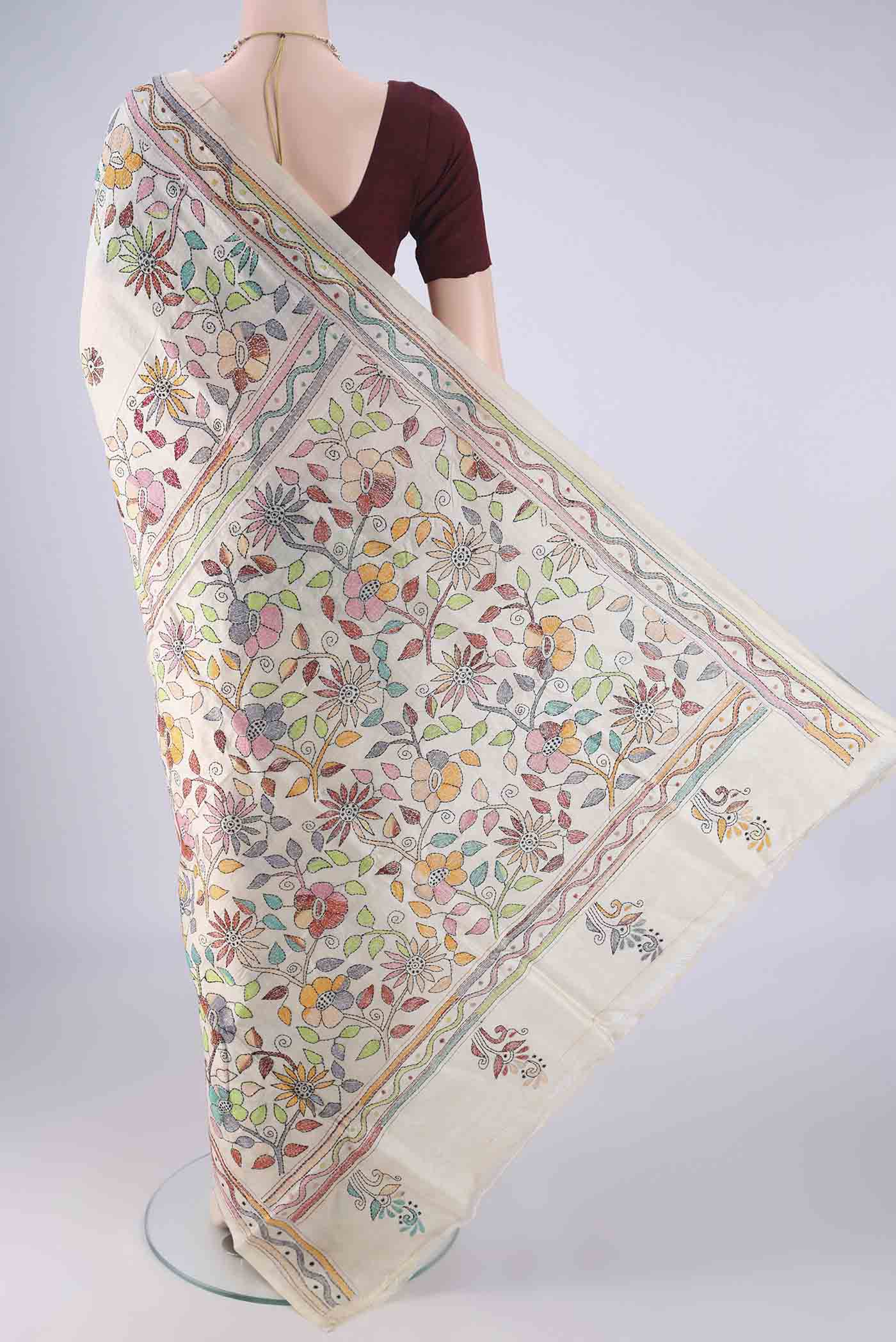 Flat view of Beige Tussar Silk Saree with Kantha Work on the body and Thread Border. 