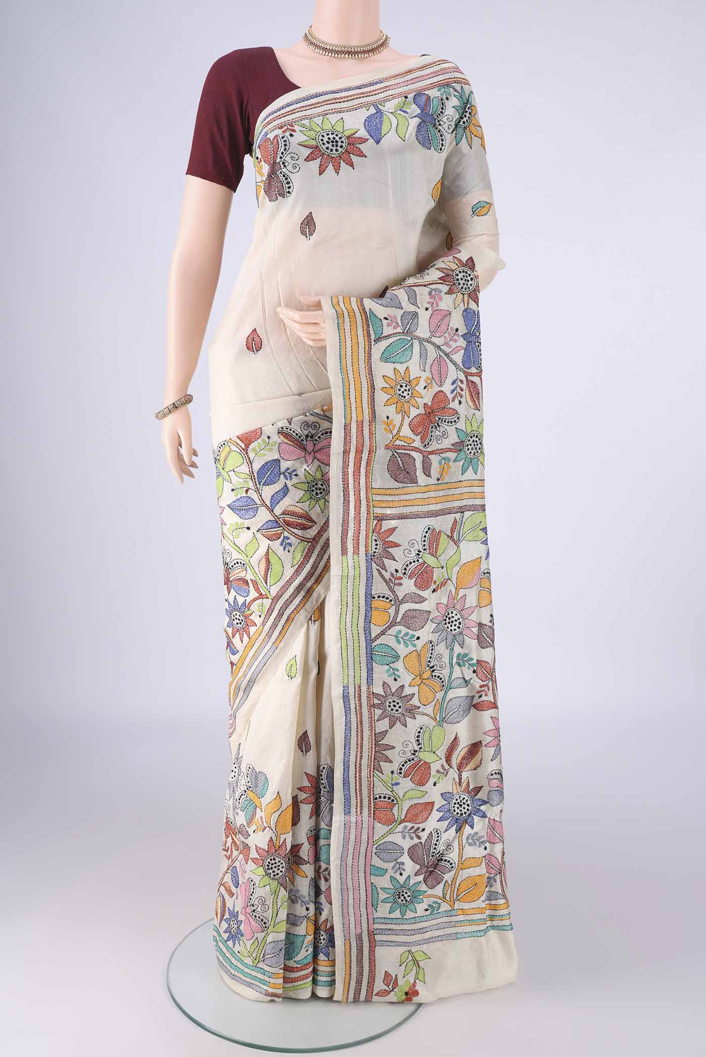 Beige Tussar Silk Saree with Kantha Work on the body and Thread Border.  displayed on a mannequin