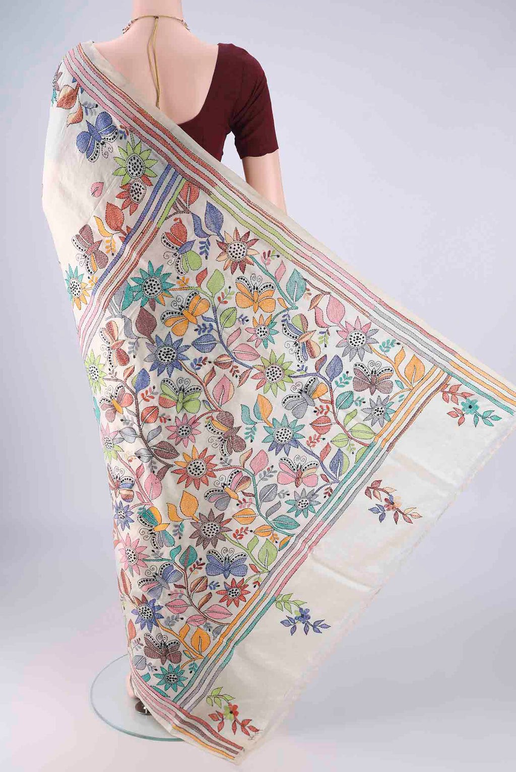 Flat view of Beige Tussar Silk Saree with Kantha Work on the body and Thread Border. 