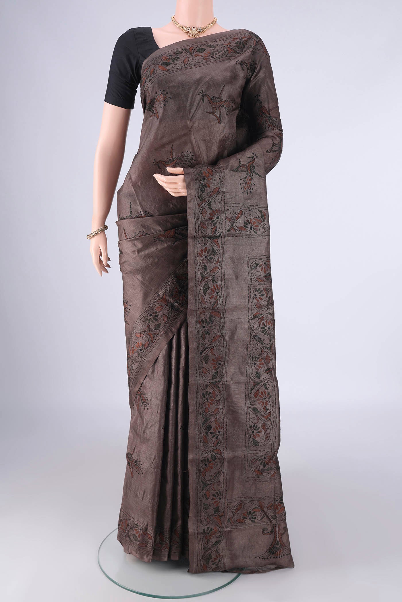 Coffee Brown Tussar Silk Saree with Kantha Work on the body and Thread Border.  displayed on a mannequin