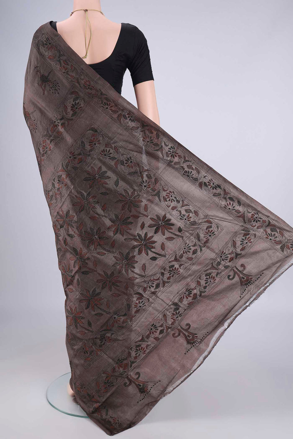 Flat view of Coffee Brown Tussar Silk Saree with Kantha Work on the body and Thread Border. 