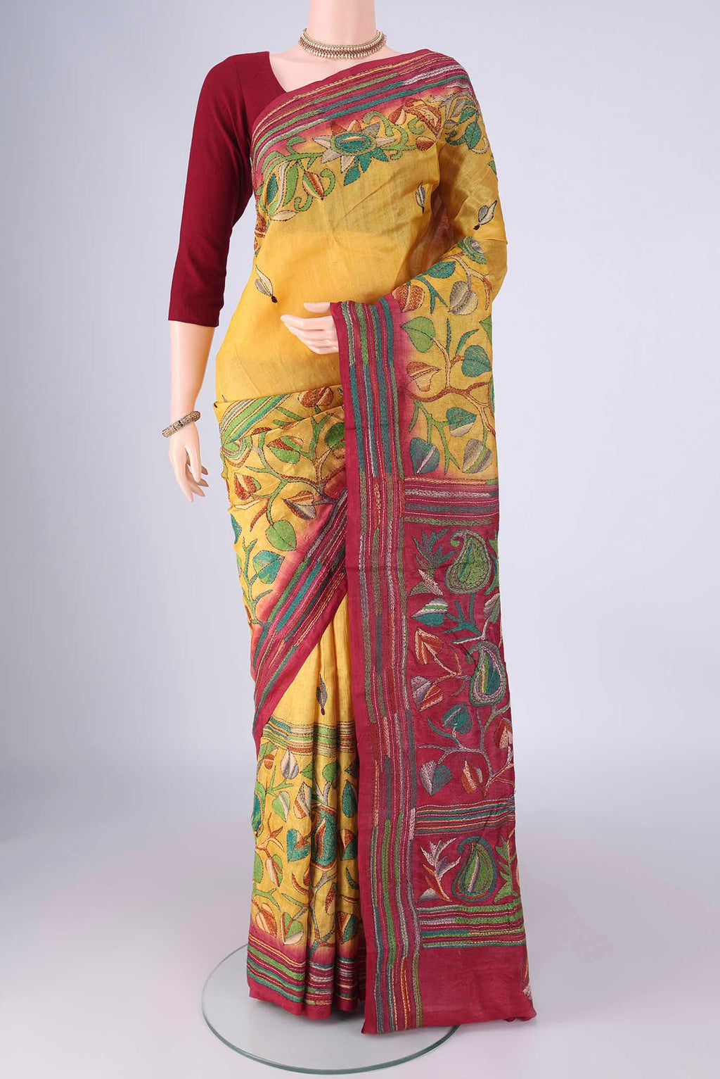Yellow Tussar Silk Saree with Kantha Work on the body and Thread Border.  displayed on a mannequin