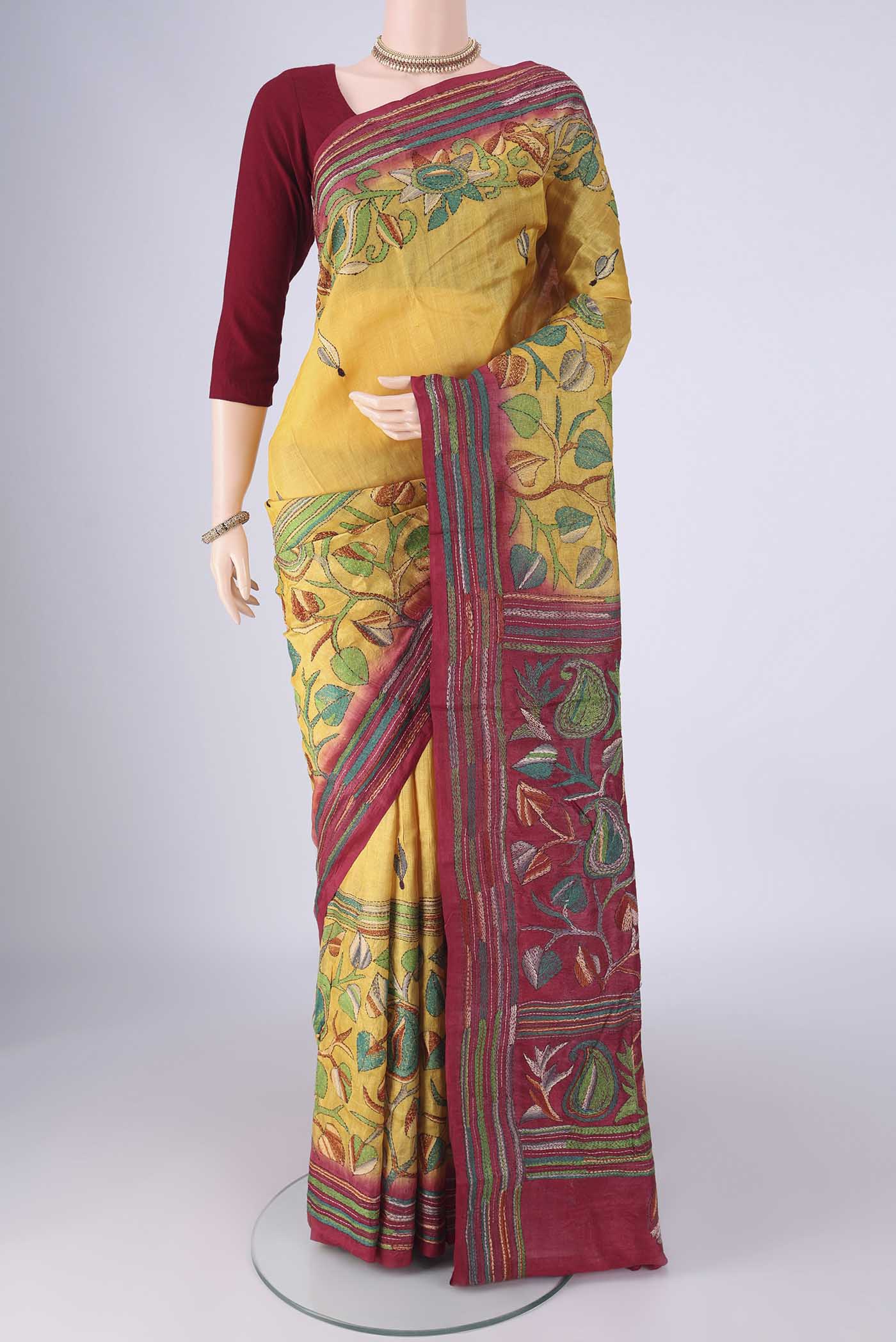 Yellow Tussar Silk Saree with Kantha Work on the body and Thread Border.  displayed on a mannequin